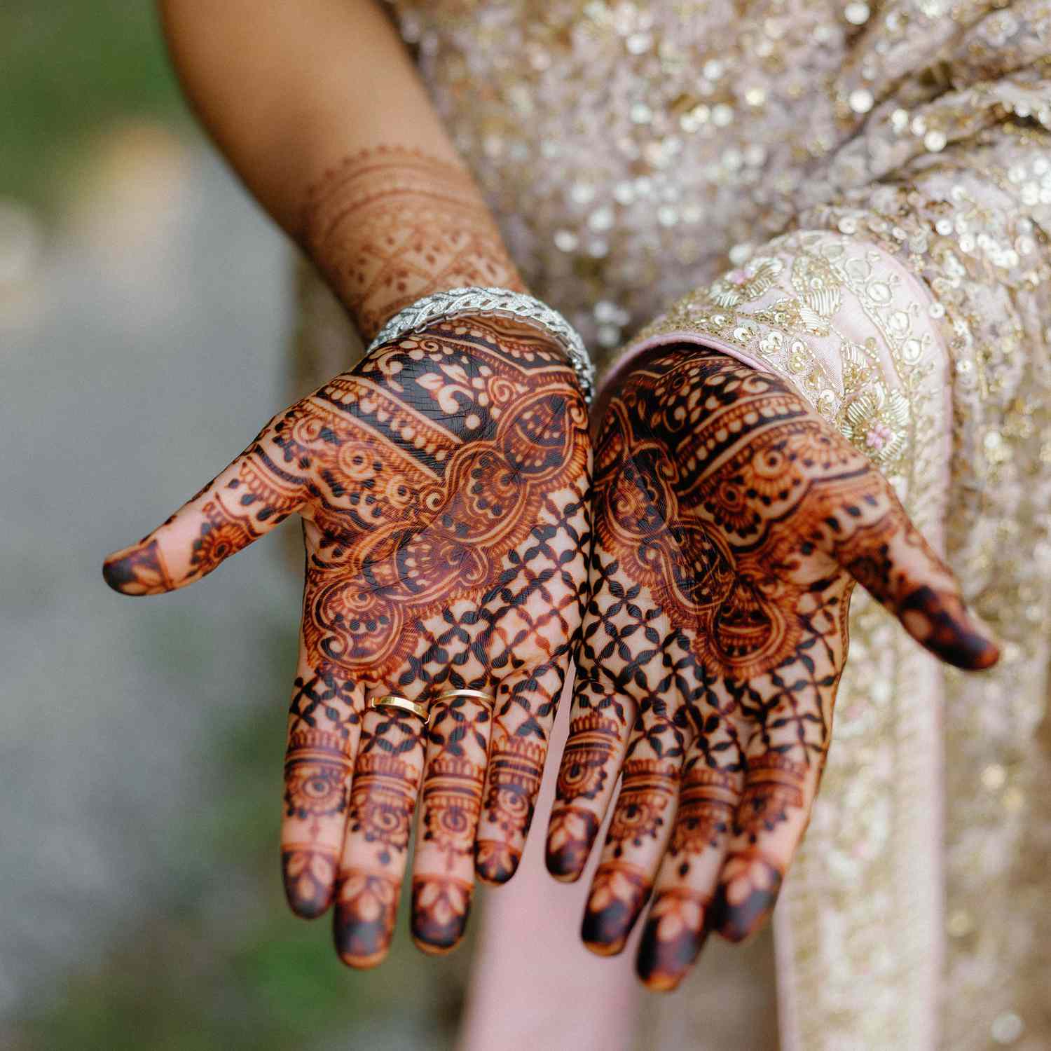 Detailed bridal henna design on two hands